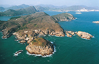 A rocky promontory along a coastline that is exposed to strong wave action.